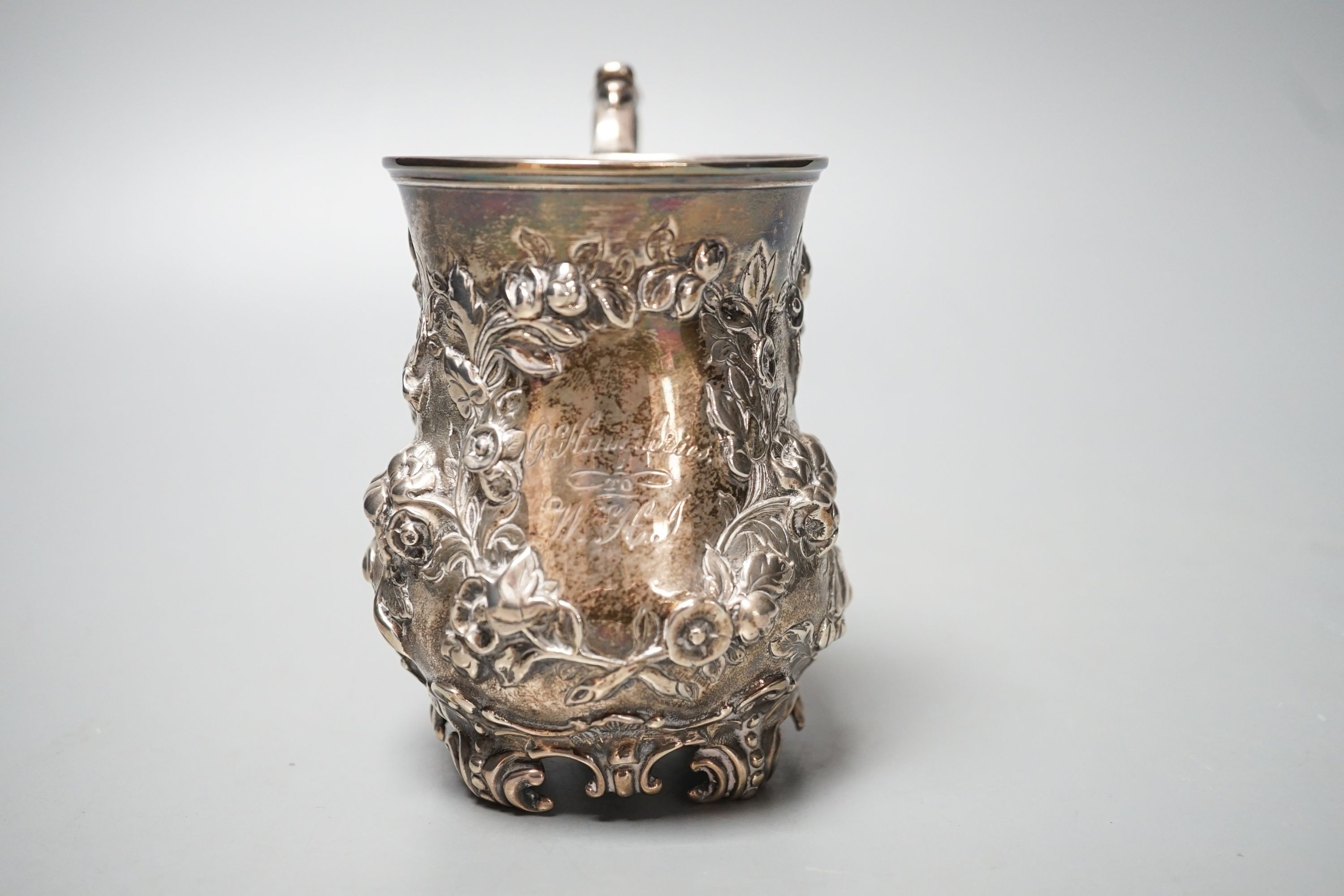 A Victorian embossed silver christening mug, Martin, Hall & Co, Sheffield, 1866, with engraved inscription, 12cm, 8oz.